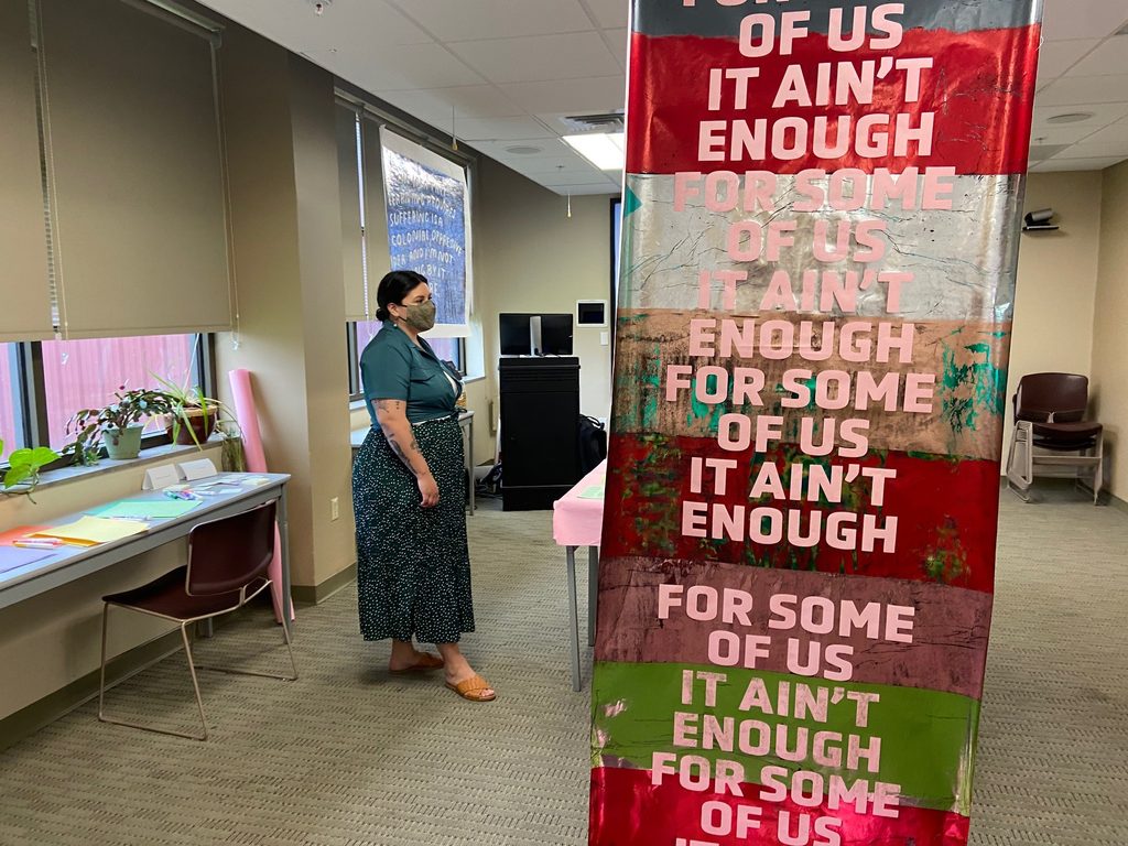 artist leads a discussion inside of of university of arkansas medical center north branch