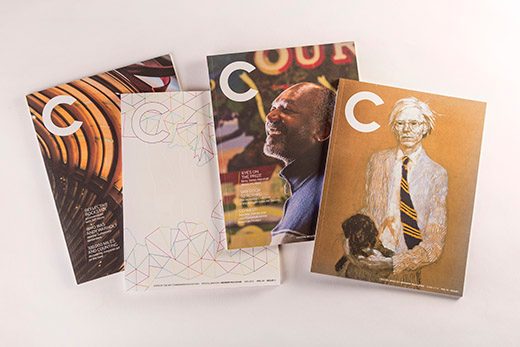 Four magazine covers featuring the letter 