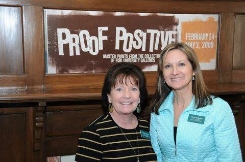 Two staff members pose together