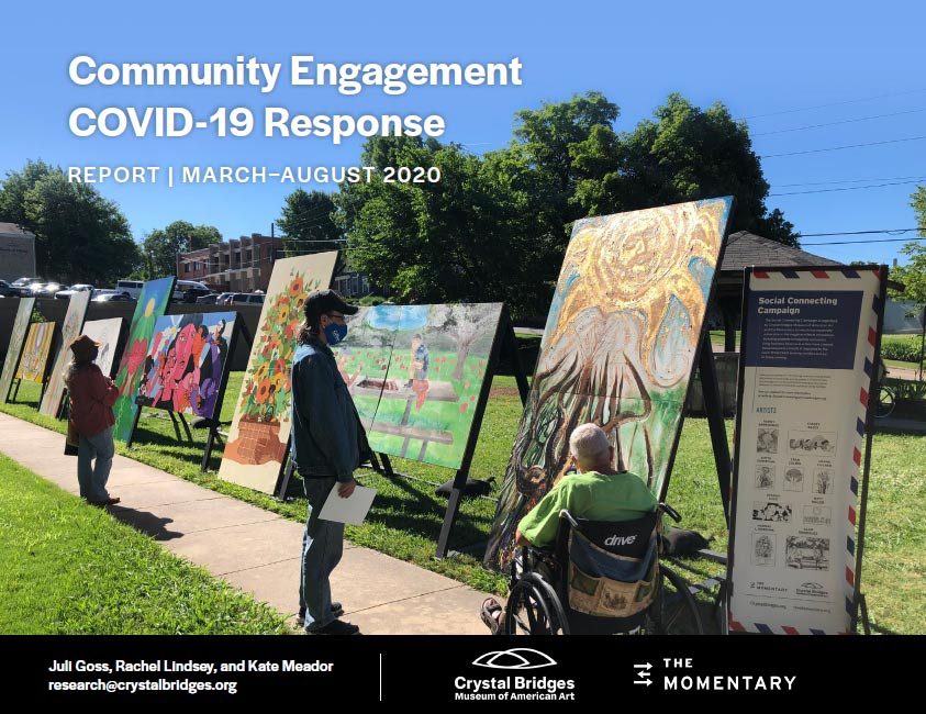 Outdoor exhibit of large art panels on sidewalk, featuring COVID-19 community response report.