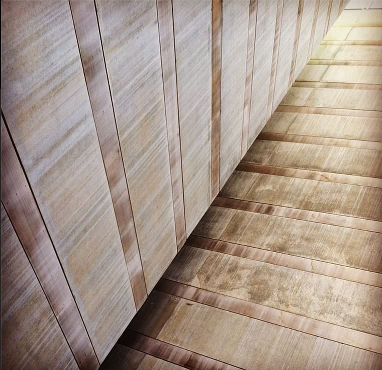 Wood-banded concrete wall for a uniform perspective.