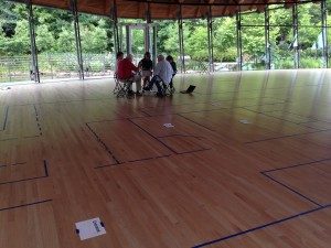 A group of Tour Guides work on their tour scripts alongside the Bachman-Wilson House floor plan. 