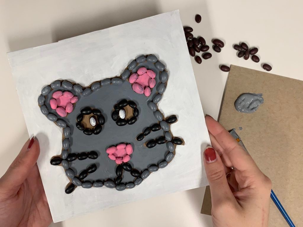 Hands making artwork