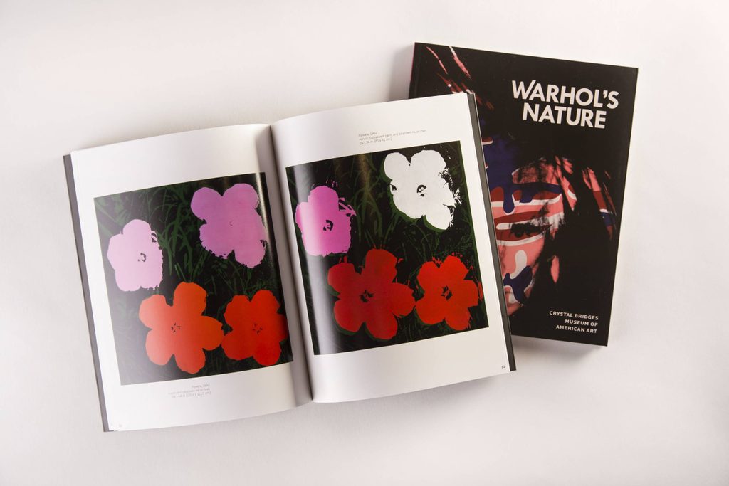 Open book with colorful flower prints and closed 