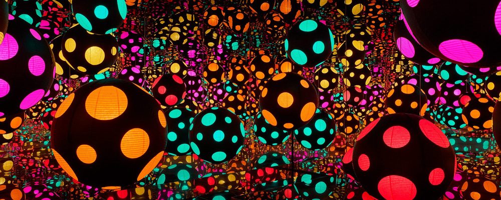 Colored paper lanterns hanging in a mirrored room