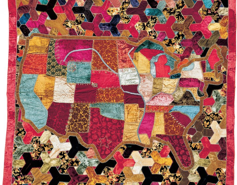 Colorful quilt with patchwork map of the USA, geometric patterns, bold colors, intricate border.