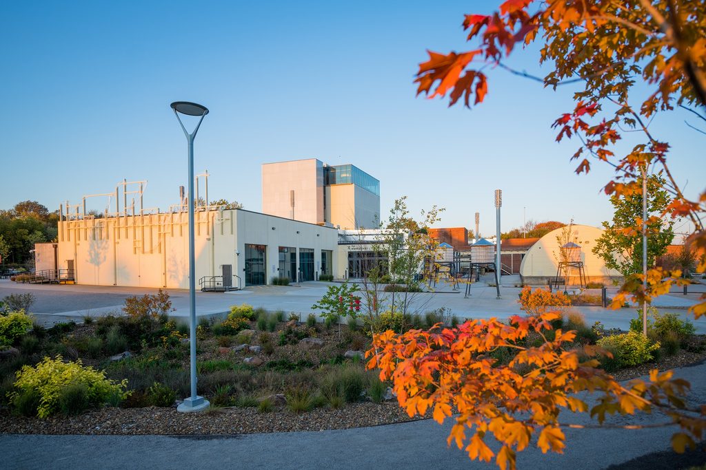 image of the momentary building with fall leaves