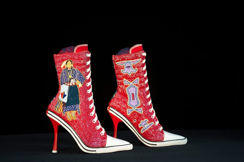 Converse style high-heeled sneakers with Native American beaded designs on the sides