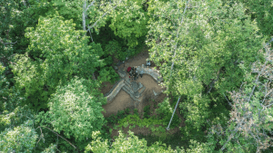 The drone turns its camera back down to the Overlook for a team selfie from the air.