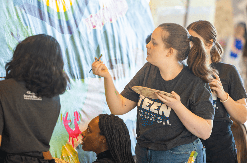 Students paint a mural at Crystal Bridges Museum of American Art
