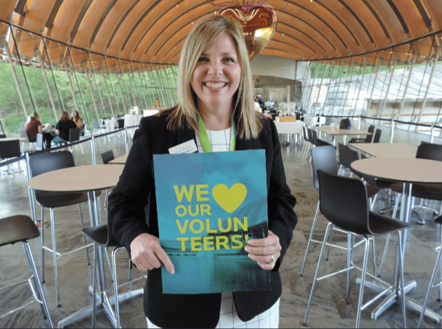 staff member poses in eleven